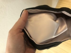 Detail of gray wool skirt showing satiny pink lining.